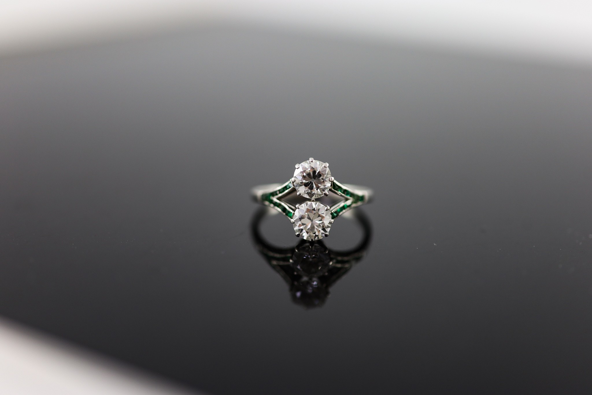 A 1920's platinum and two stone diamond ring